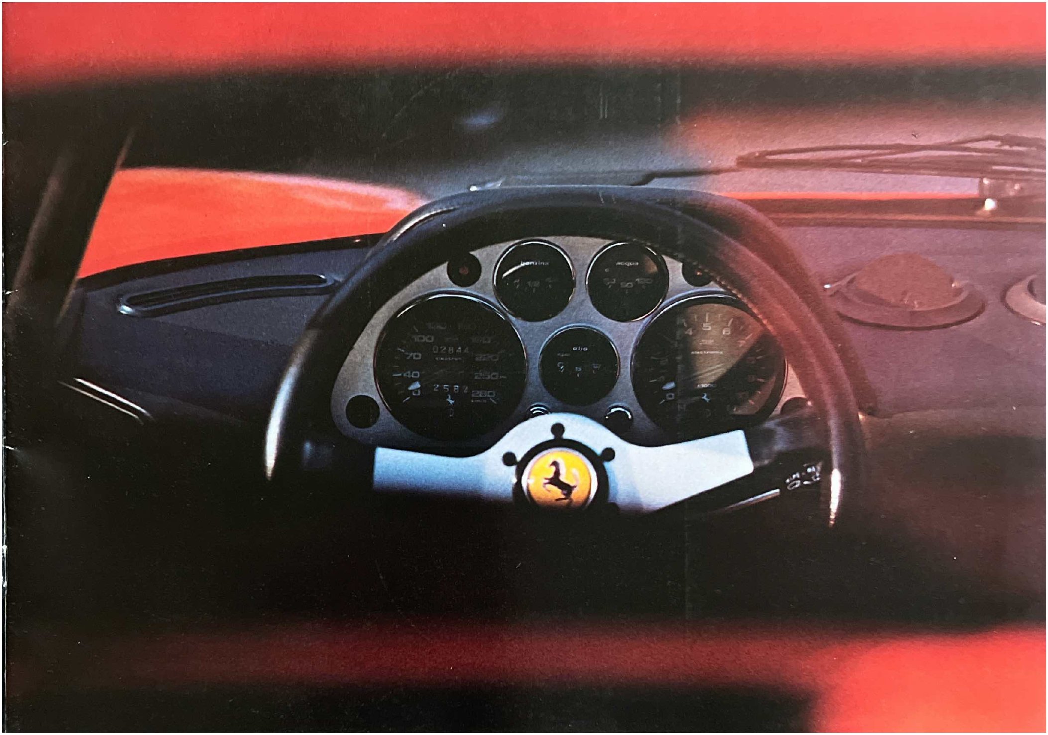 Ferrari 308 brochure — front three-quarter on white