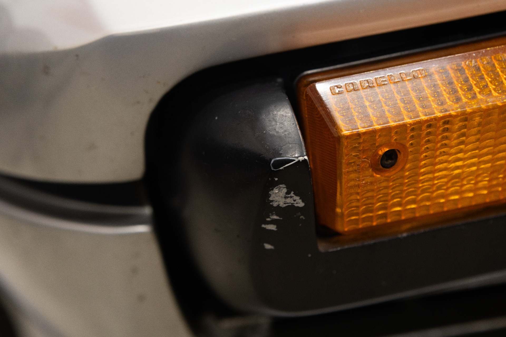 Paint chip on black bumper trim by indicator