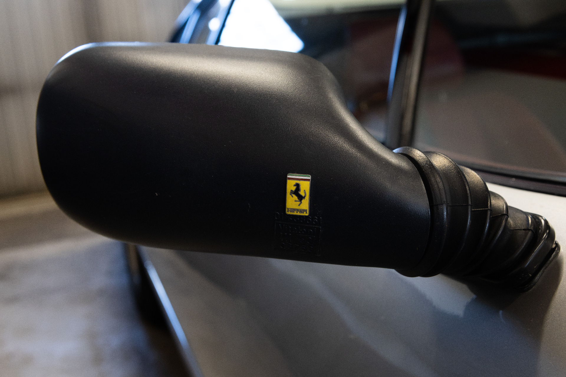 Black original mirror with Ferrari marking