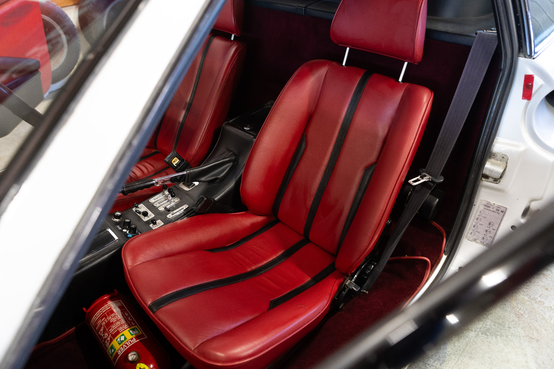 Passenger seat and centre console seen through the side window
