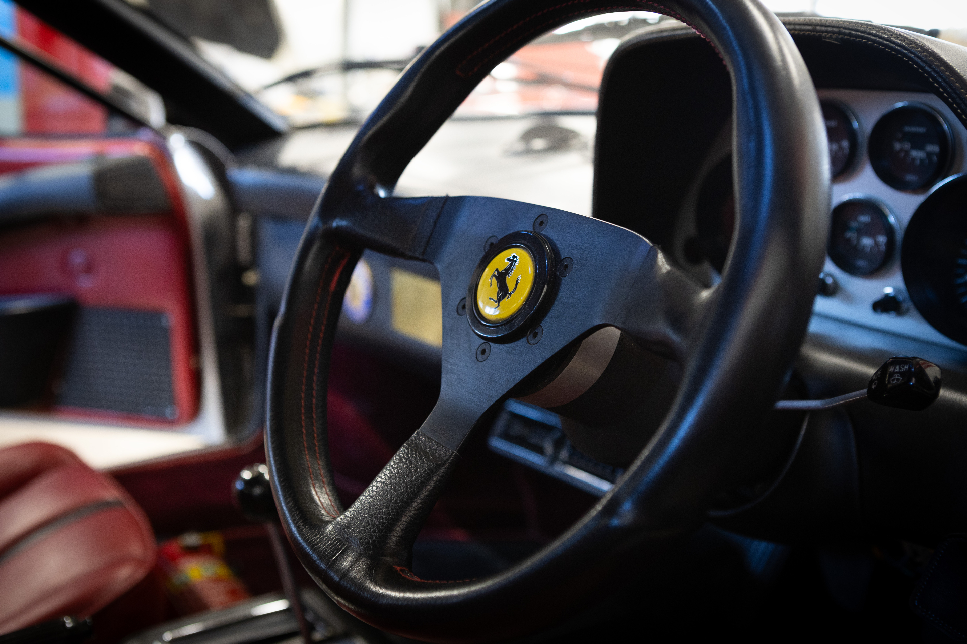 Close-up of steering wheel with Ferrari emblem