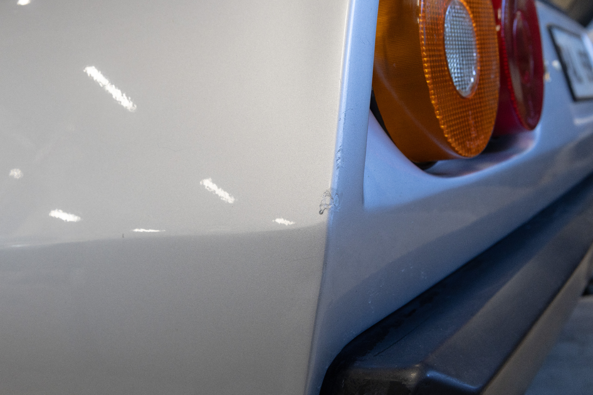 Chip on edge next to tail light