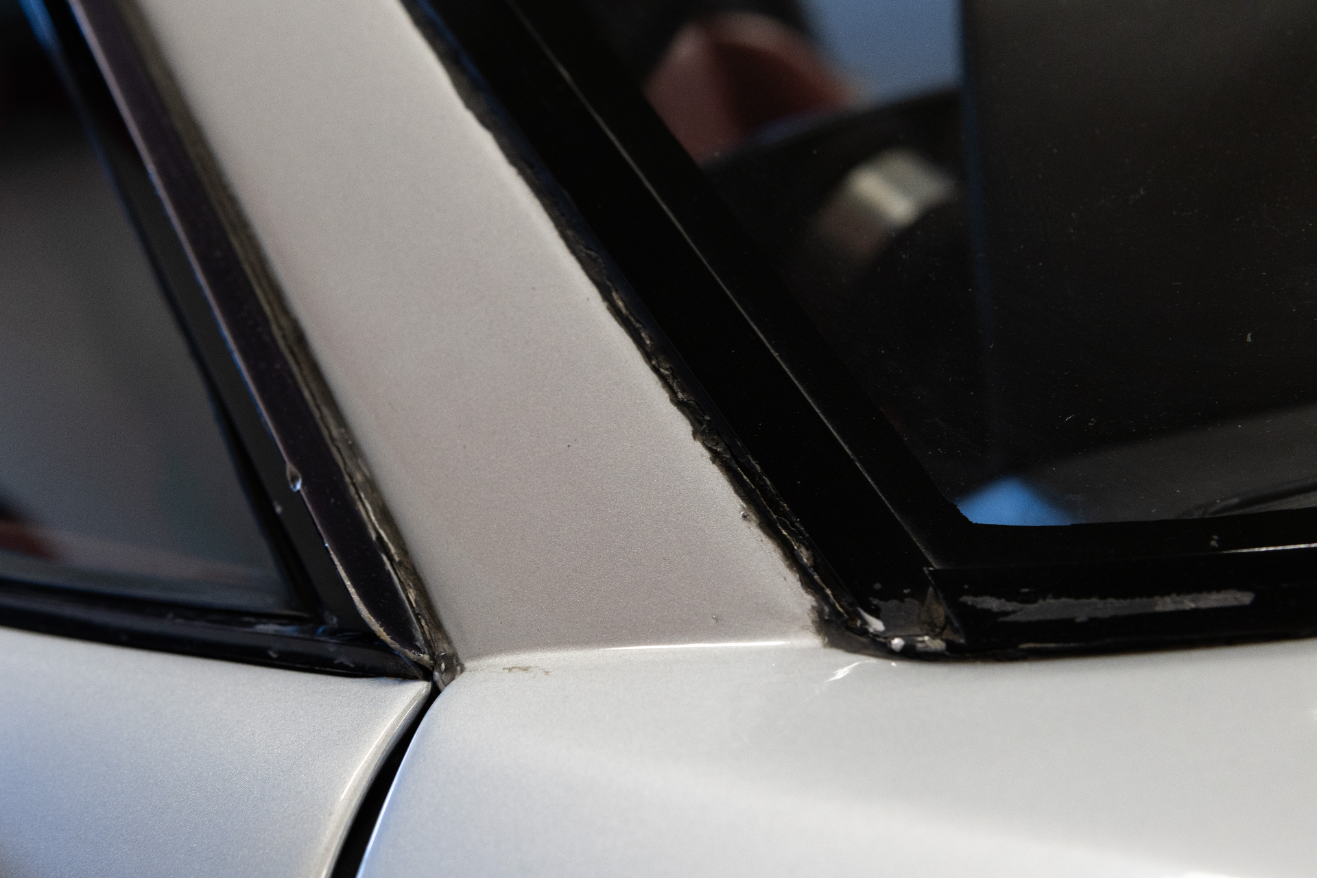 Seal and trim around side window, close-up