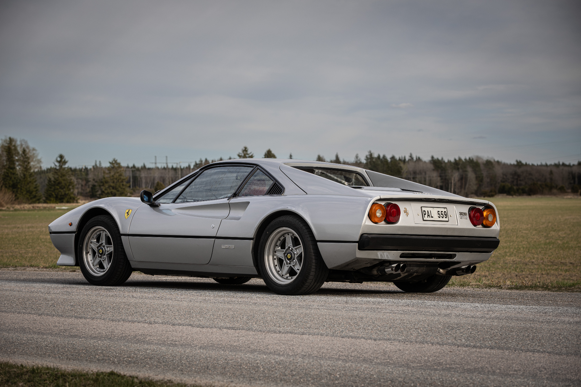 Ferrari 308 GTB rear three-quarter on country road