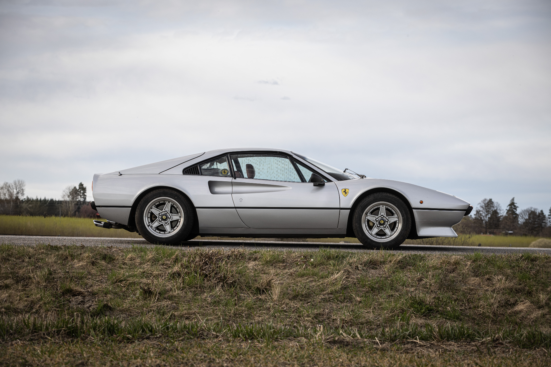 Ferrari 308 GTB side profile on country road