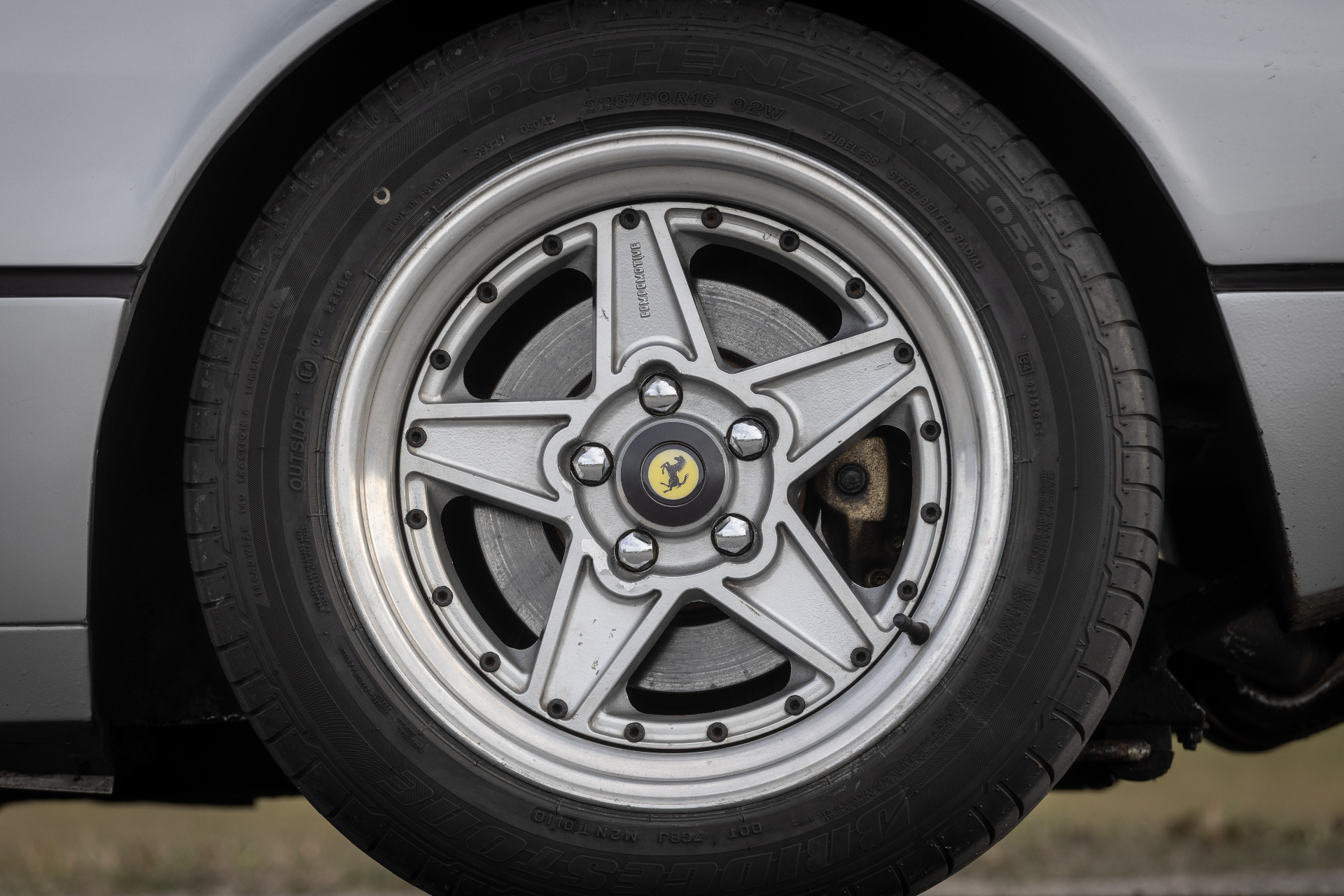 Close-up of Compomotive split-rim wheel